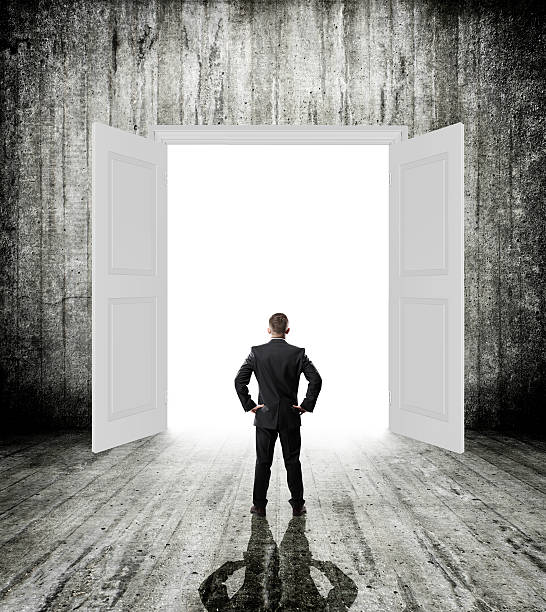 istock opened door with businessman 489651285