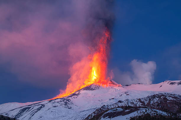 Volcano Etna produces fountain of lava during continued eruption. stock photo
