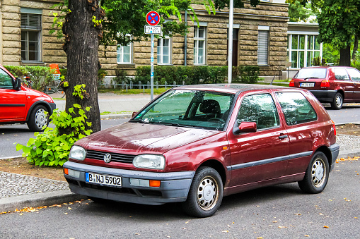 Berlin, Germany - September 10, 2013: Motor car Volkswagen Golf is parked at the city street.
