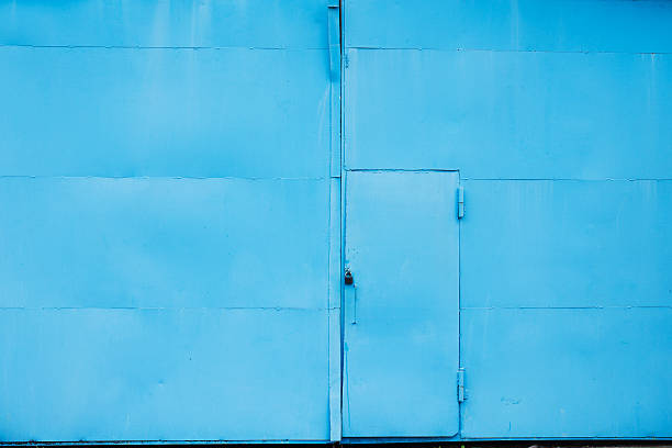 istock Blue steel door of a warehouse 489660642