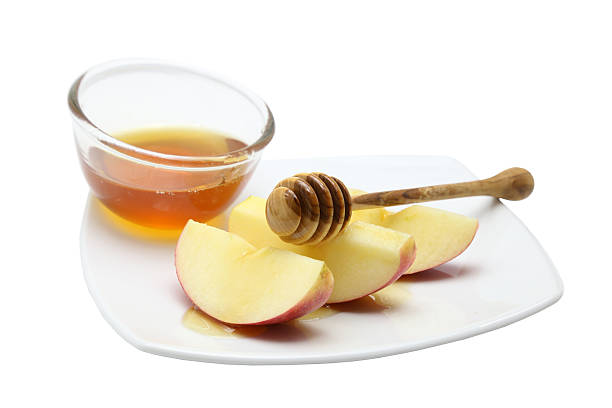 istock Honey and apple on white background 489661622