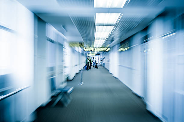 istock Blur motion of passengers walking at airport 489662472