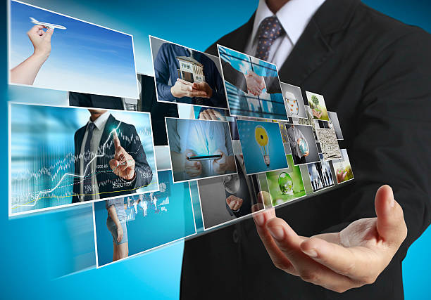 istock businessmen and Reaching images streaming 489664668