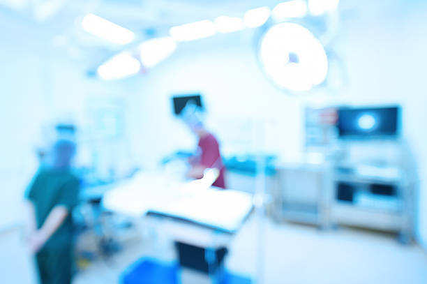 istock Blur of two veterinarian surgeons in operating room 489665132