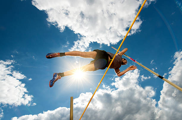 istock Below view of a young athlete at pole vault competition. 489665732