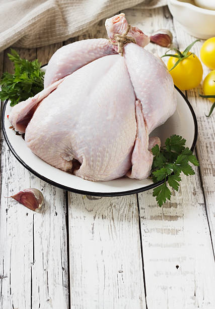 istock Chicken on a white wooden background 489666960