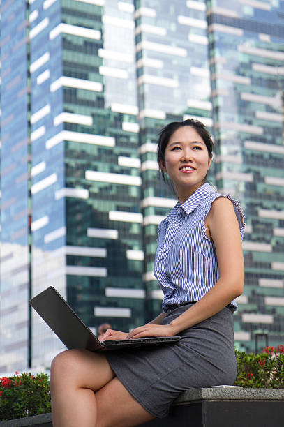 istock Young attractive Asian business woman looking forward 489671122