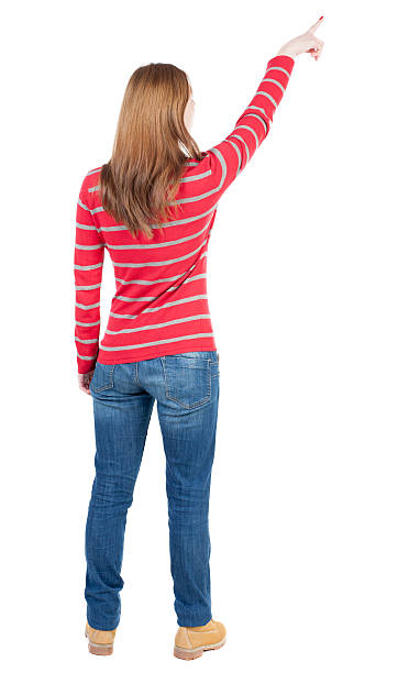 istock Back view of  pointing woman. 489673810