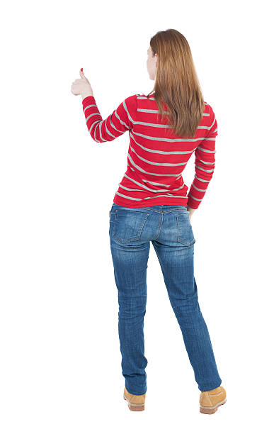 istock Back view of  woman thumbs up. 489673954