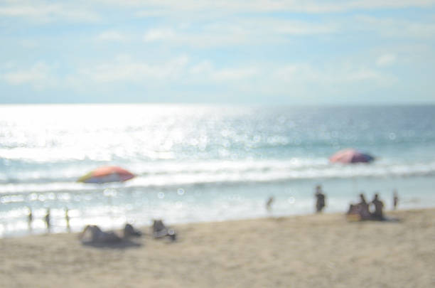 istock Blur umbrella on beach abstract background 489689278