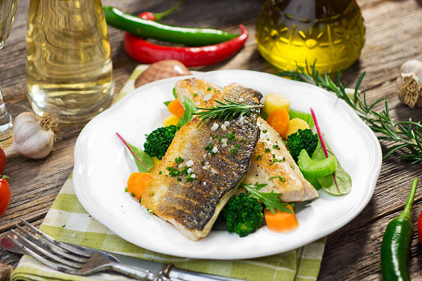 istock Sea bass fillet with vegetables 489689362