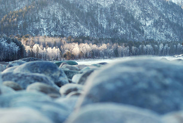Winter mountain landscape. Winter forest. Winter river. Magic winter landscape. Winter sunset background.