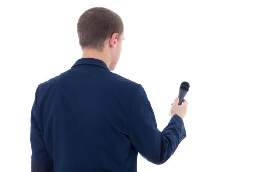 young journalist with microphone isolated on white background