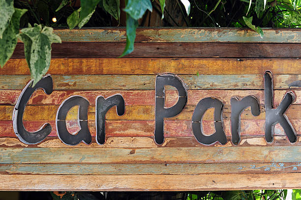 istock carpark sign on wood, natural background 489693957
