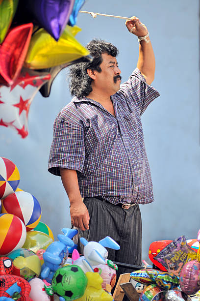 Oaxaca City, Oaxaca, Mexico, November 2, 2009: Balloon seller in the main plaza during the Day of the Dead festivities.