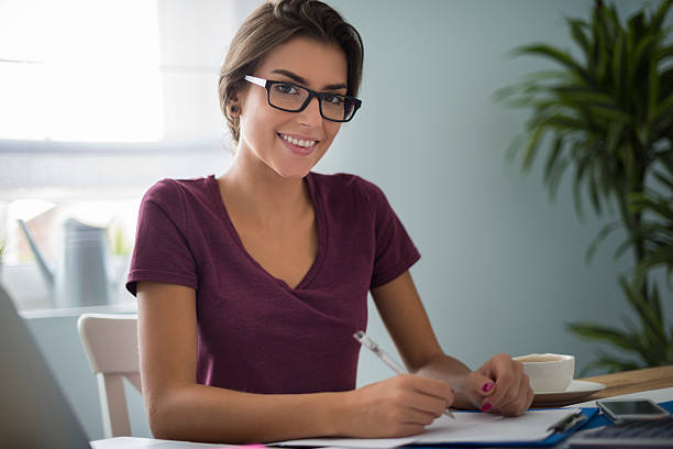 istock Dutiful woman at her house office 489694826