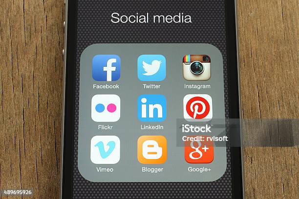 Iphone With Popular Social Media Icons On Its Screen Stock Photo - Download Image Now