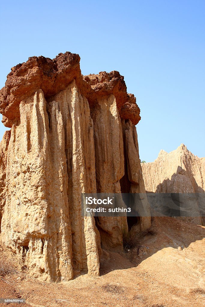 Sandstone on blue sky Sandstone on blue sky happened from the soil erosion of Rain and wind naturally at Park Nation Nan,Thailand Thailand Stock Photo