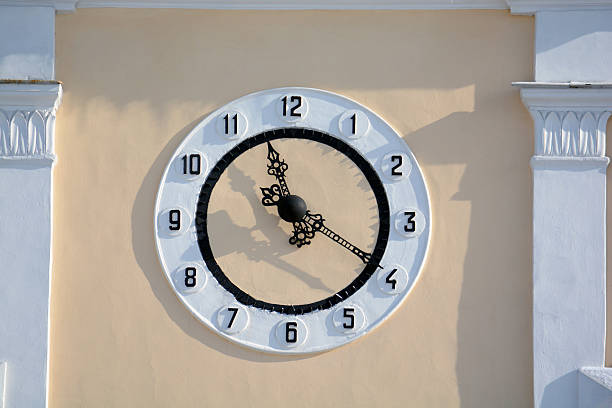 istock clock on the wall of a building 489696312
