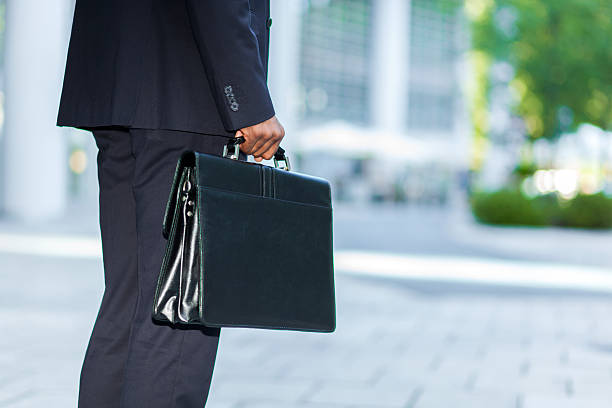 istock Black businessman carrying a briefcase 489696702