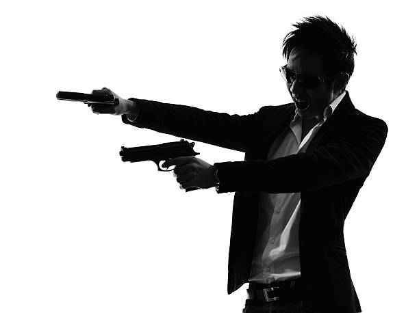 istock asian gunman killer portrait shooting silhouette 489697499