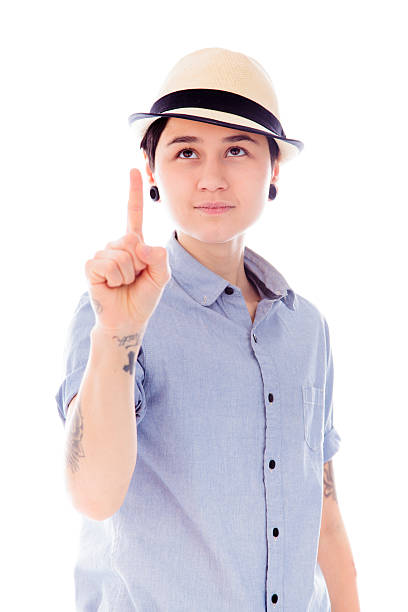 istock Young woman pointing upward 489698101