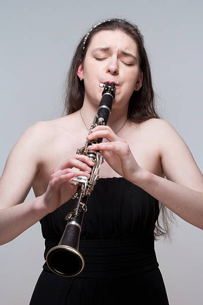 istock Young Female Musician Playing Clarinet 489698473