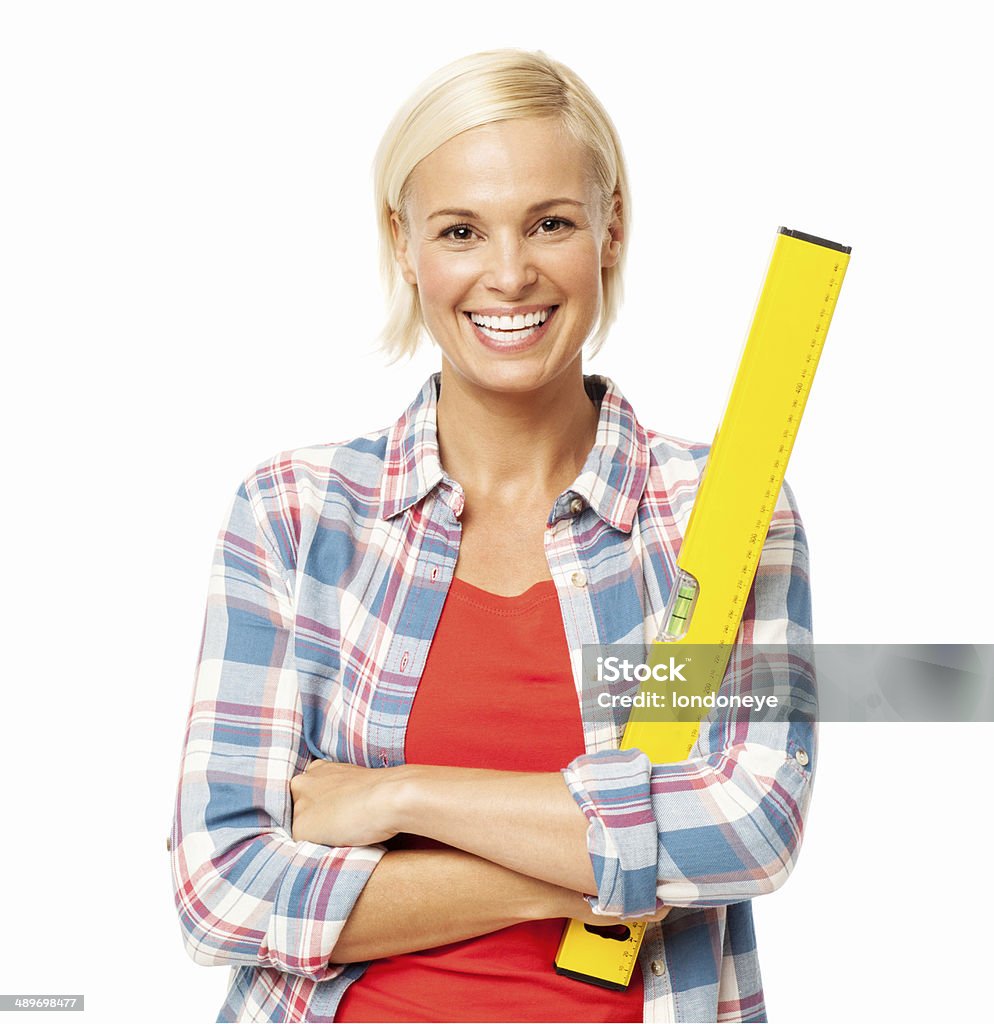 Female Carpenter With Spirit Level Standing Arms Crossed Portrait of happy female carpenter with spirit level standing arms crossed isolated over white background. Horizontal shot. Arms Crossed Stock Photo