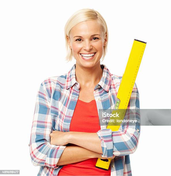 Female Carpenter With Spirit Level Standing Arms Crossed Stock Photo - Download Image Now