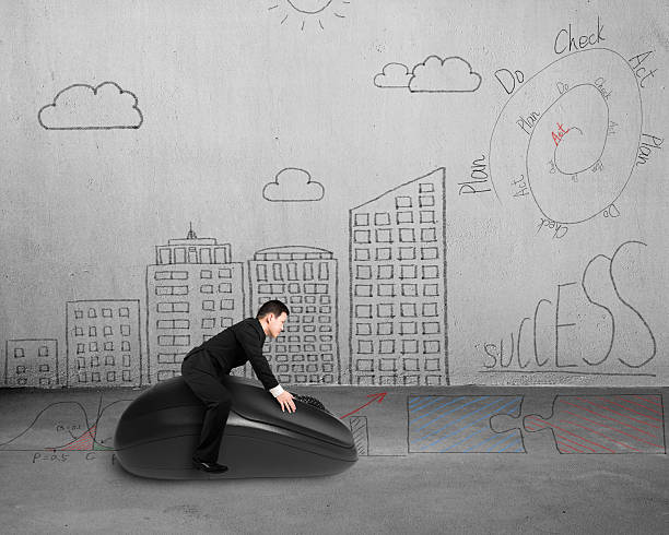 istock riding on mouse with business and building doodles 489698997
