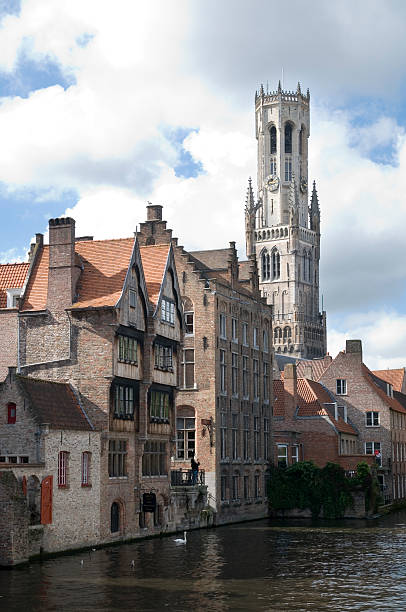 Bruges canal and cathedral stock photo