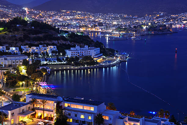 View of Bodrum harbor and Castle of St. Peter by night. Turkish Riviera.