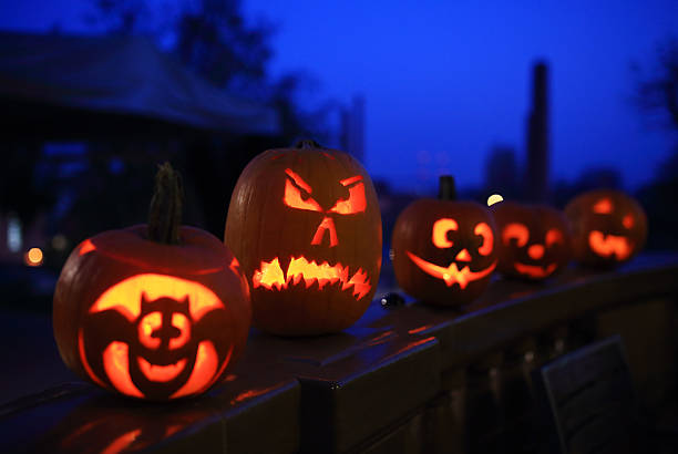 istock Funny halloween pumpkins at night 489723768