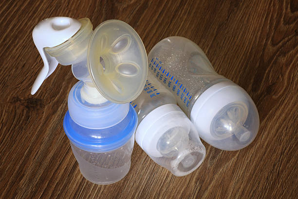 istock breast and baby bottles 489724076