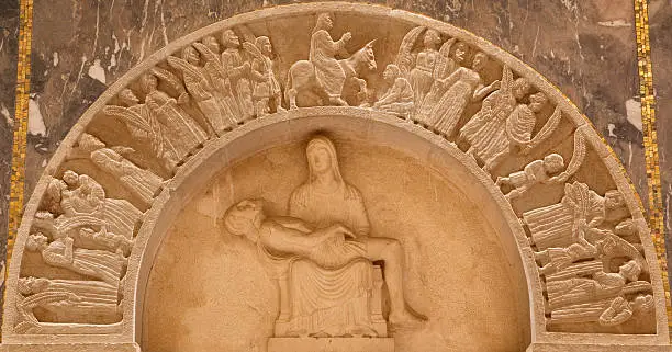 Jerusalem - The pieta and Entry of Jesus to Jerusalem (Palm sunday) relief in Evangelical Lutheran Church of Ascension by unknown artist of 20. cent.