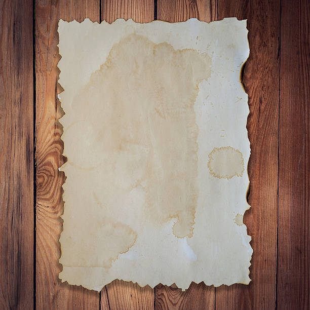 istock old paper on wood background and texture with space. 489725508