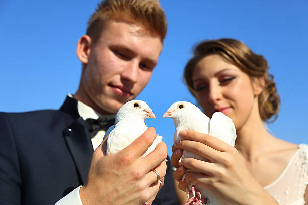 istock Wedding couple with pigeons 489726258