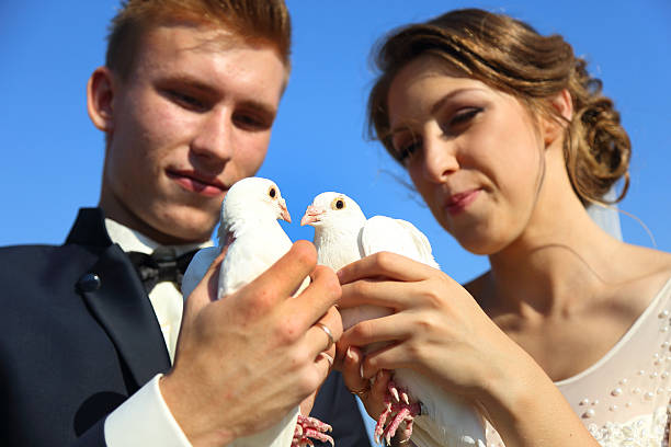 istock Wedding couple with pigeons 489726276