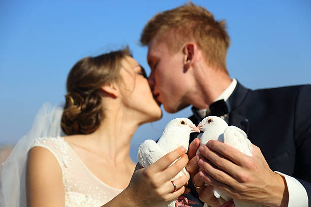 istock Wedding couple with pigeons 489726298