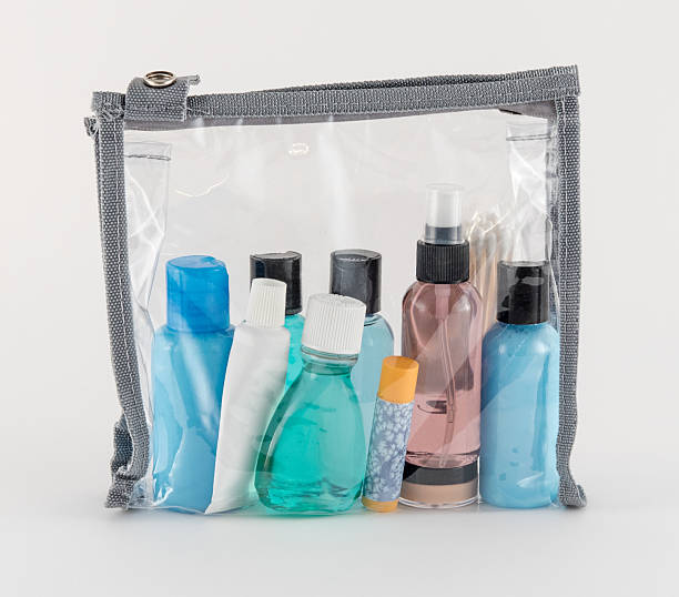 travel toiletries in clear plastic bag - hotel shampoo stockfoto's en -beelden