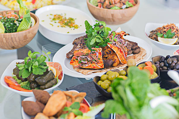 canapes as a treat for the holiday. small sandwiches, rolls and burgers in a plate on the table.