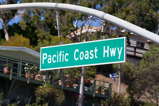Pacific Coast Hwy A sign on Pacific Coast Hwy in Southern California. laguna beach california photos stock pictures, royalty-free photos & images
