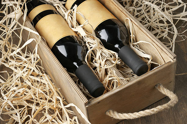 istock Wine bottles in wooden box and straw 489734630