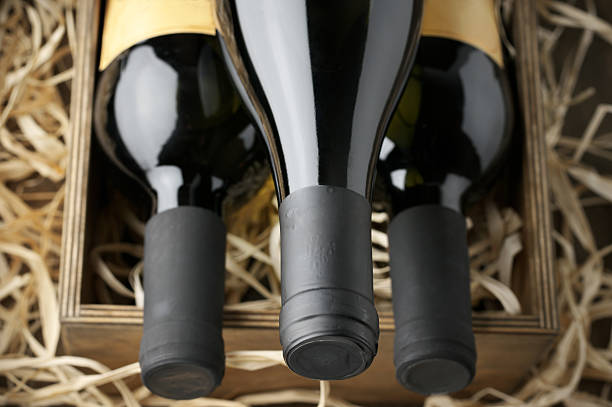istock Wine bottles in wooden box and straw 489735016