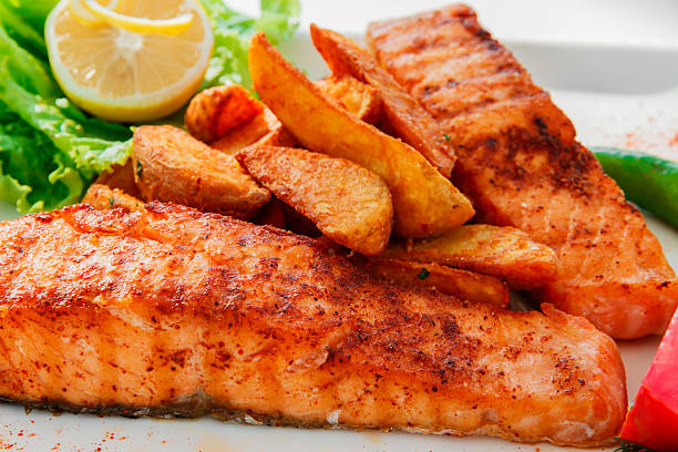 istock fried fish fillet of salmon with potatoes 489735048