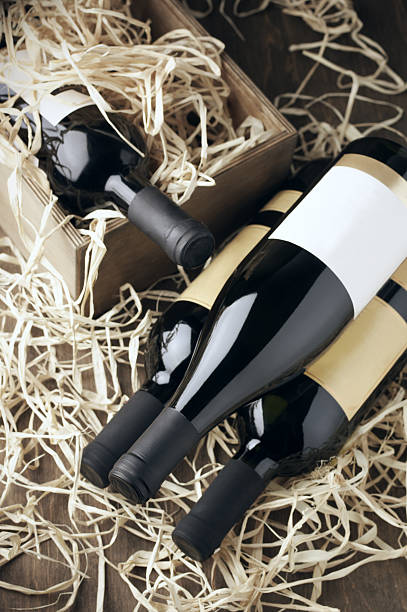 istock Wine bottles in wooden box and straw 489735536