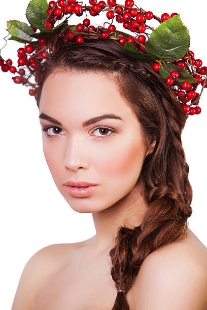 istock woman with a wreath of berries 489748979