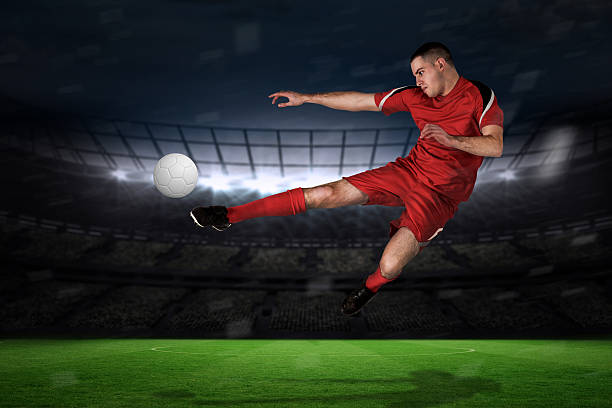 istock Fit football player playing and kicking 489749599
