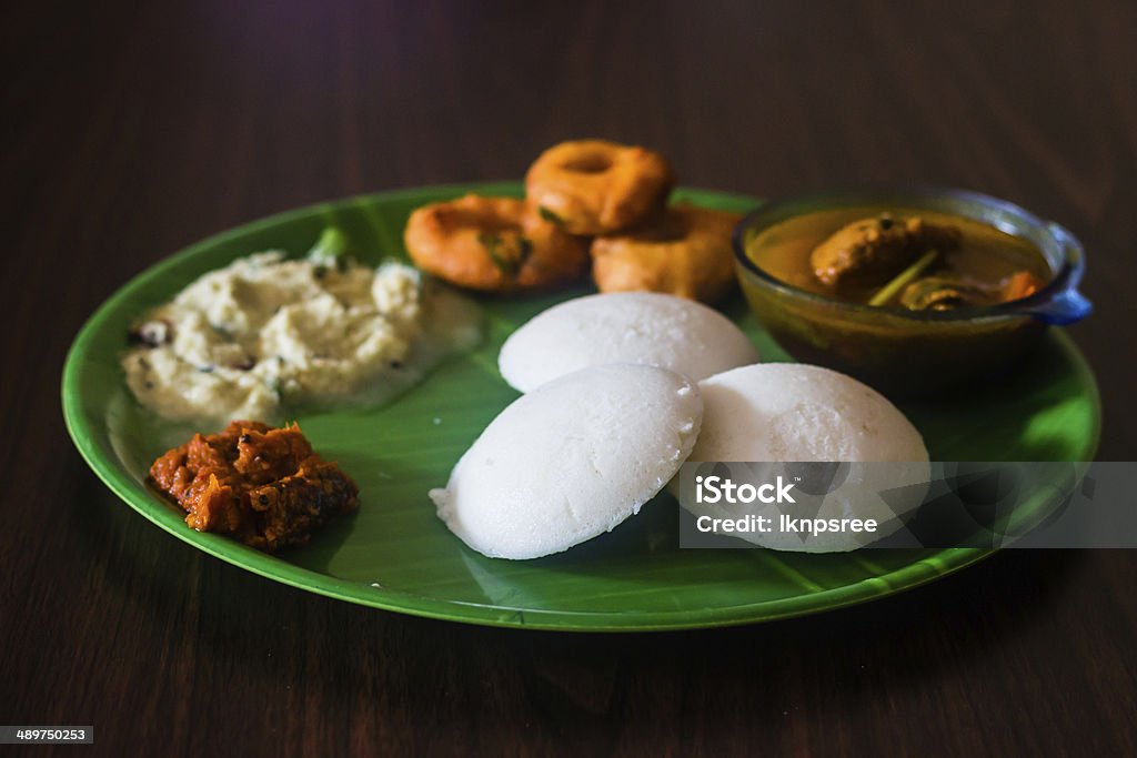 Breakfast menu for special occassions in south india Breakfast menu fo special occassions like Diwali ,weddings in south india with idli,vada,chutney served on a plantain model plate.healthy menu because of its healthy pulses and cereal ingredientsBreakfast menu fo special occassions like Diwali ,weddings in south india with idli,vada,chutney served on a plantain model plate.healthy menu because of its healthy pulses and cereal ingredients Breakfast Stock Photo