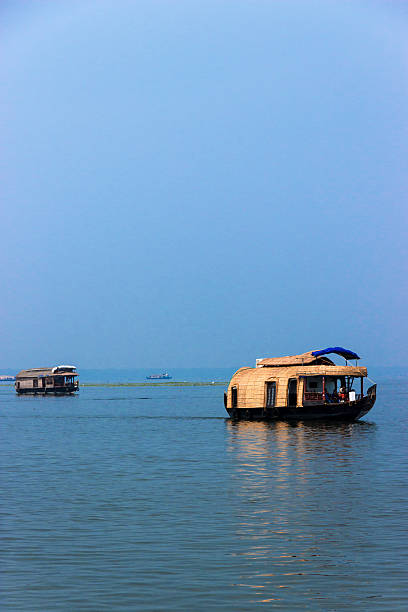 House boat in kerala backwaters with all the facilities inside the boat just as a hotel room with all the amenities while travelling in the lake